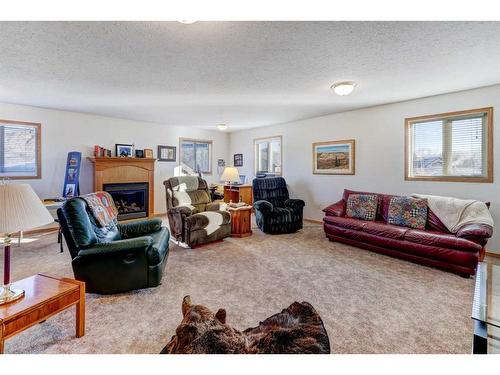 221 13 Street Nw, Drumheller, AB - Indoor Photo Showing Living Room With Fireplace