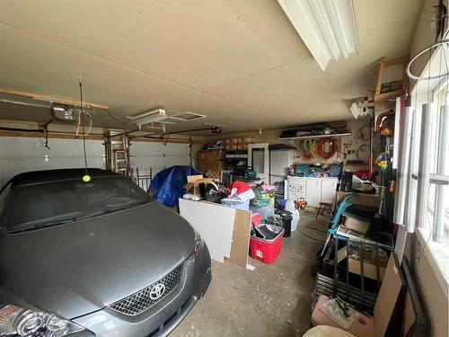 16 Evergreen  Park Close, Brooks, AB - Indoor Photo Showing Garage