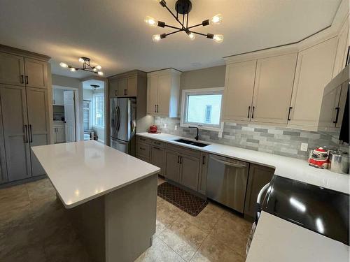 16 Evergreen  Park Close, Brooks, AB - Indoor Photo Showing Kitchen With Double Sink