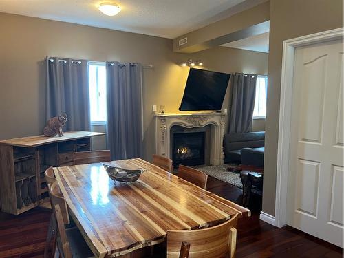Unit 5-360 4 Street West, Drumheller, AB - Indoor Photo Showing Dining Room With Fireplace