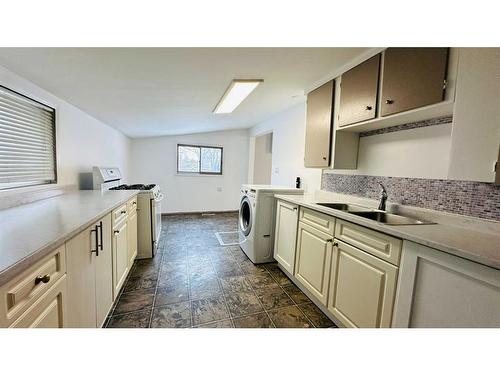 107 3 Street, Drumheller, AB - Indoor Photo Showing Kitchen With Double Sink