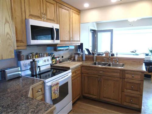 55 Centre Street, Drumheller, AB - Indoor Photo Showing Kitchen With Double Sink