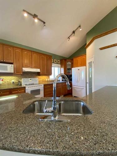 67 Park Place West, Brooks, AB - Indoor Photo Showing Kitchen With Double Sink