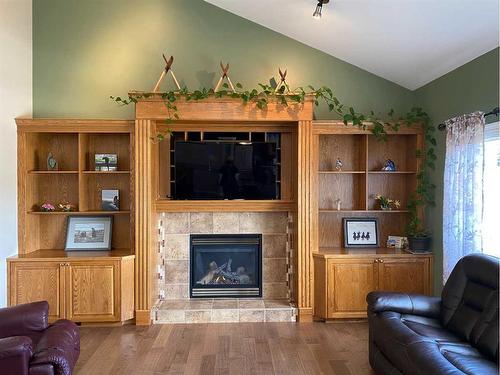 67 Park Place West, Brooks, AB - Indoor Photo Showing Living Room With Fireplace