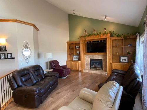 67 Park Place West, Brooks, AB - Indoor Photo Showing Living Room With Fireplace