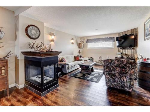 610 Greene Close, Drumheller, AB - Indoor Photo Showing Living Room With Fireplace