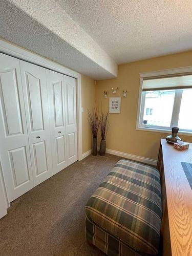 24 Evergreen Park Close West, Brooks, AB - Indoor Photo Showing Bedroom