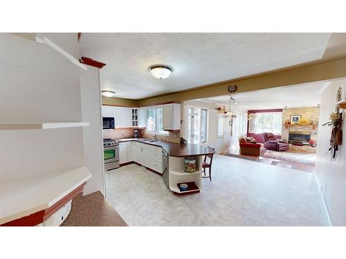 525 8 Avenue, Bassano, AB - Indoor Photo Showing Other Room With Fireplace