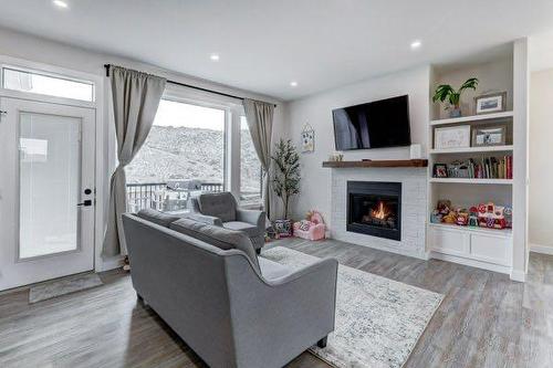 149 10 Avenue Se, Drumheller, AB - Indoor Photo Showing Living Room With Fireplace