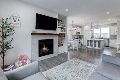 149 10 Avenue Se, Drumheller, AB - Indoor Photo Showing Living Room With Fireplace