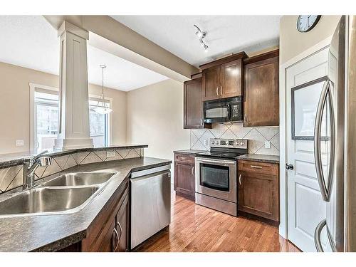73 Cranleigh Heath Se, Calgary, AB - Indoor Photo Showing Kitchen With Double Sink