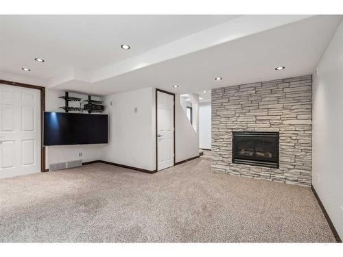 110 Coventry Crescent Ne, Calgary, AB - Indoor Photo Showing Living Room With Fireplace