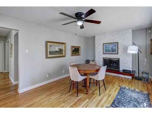 150 9 Street Nw, Drumheller, AB - Indoor Photo Showing Dining Room With Fireplace