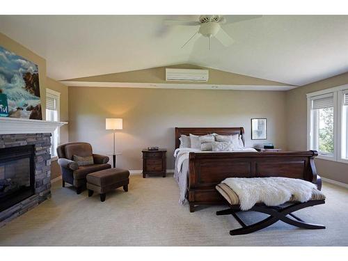 182048 Rge Rd 163, Rural Newell, County Of, AB - Indoor Photo Showing Bedroom With Fireplace