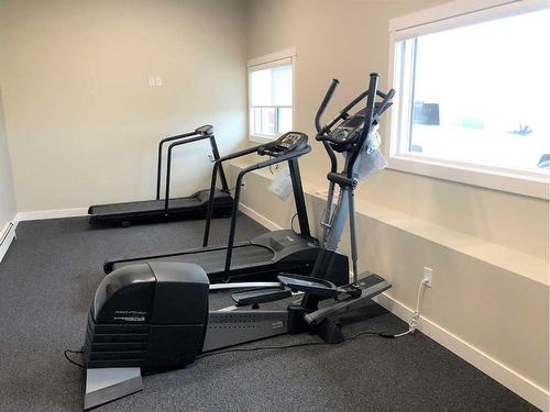 205-499 Meadow Lake Court East, Brooks, AB - Indoor Photo Showing Gym Room