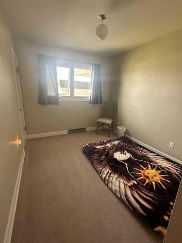 413 6 Avenue West, Hanna, AB - Indoor Photo Showing Bedroom