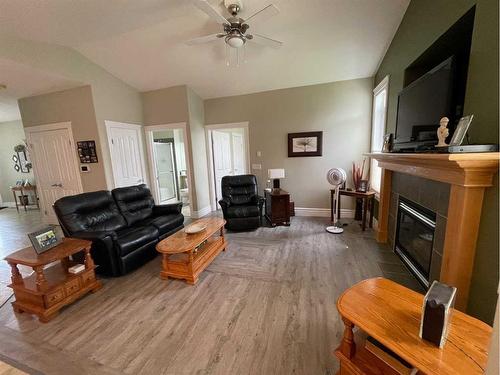 5037 Shannon Drive, Olds, AB - Indoor Photo Showing Living Room With Fireplace