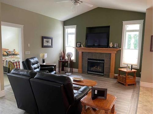 5037 Shannon Drive, Olds, AB - Indoor Photo Showing Living Room With Fireplace