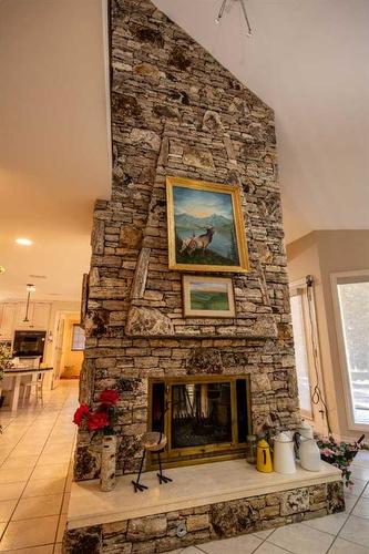 23 Range Road 62, Rural Mountain View County, AB - Indoor Photo Showing Other Room With Fireplace