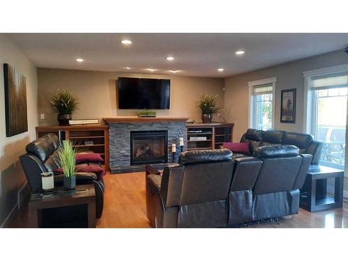 166 Railway Avenue, Drumheller, AB - Indoor Photo Showing Living Room With Fireplace