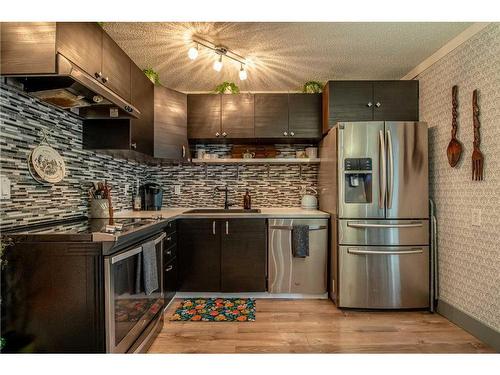 80 Ashwood Road Se, Airdrie, AB - Indoor Photo Showing Kitchen With Stainless Steel Kitchen With Upgraded Kitchen