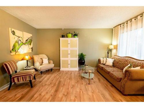 80 Ashwood Road Se, Airdrie, AB - Indoor Photo Showing Living Room