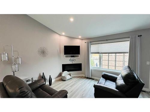 20 Garden Way, Drumheller, AB - Indoor Photo Showing Living Room With Fireplace