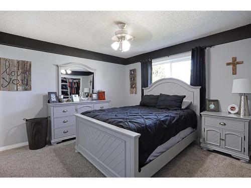 65 Parkland Way East, Brooks, AB - Indoor Photo Showing Bedroom