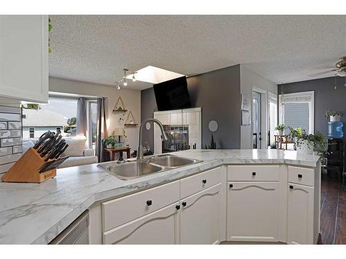 65 Parkland Way East, Brooks, AB - Indoor Photo Showing Kitchen With Double Sink