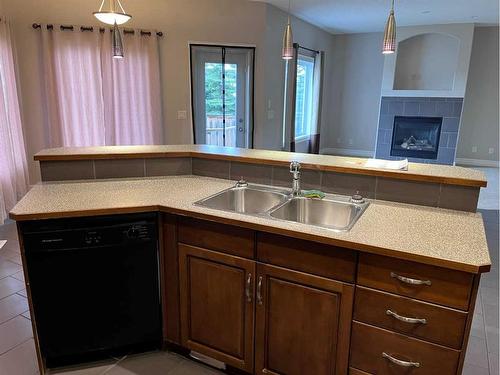 122 Coopers Bay Sw, Airdrie, AB - Indoor Photo Showing Kitchen With Double Sink