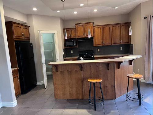 122 Coopers Bay Sw, Airdrie, AB - Indoor Photo Showing Kitchen