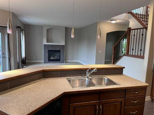 122 Coopers Bay Sw, Airdrie, AB - Indoor Photo Showing Kitchen With Double Sink