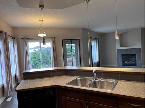 122 Coopers Bay Sw, Airdrie, AB - Indoor Photo Showing Kitchen With Double Sink