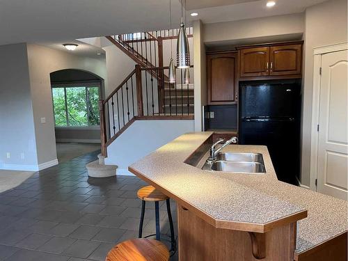 122 Coopers Bay Sw, Airdrie, AB - Indoor Photo Showing Kitchen With Double Sink