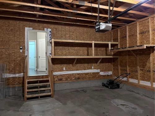 122 Coopers Bay Sw, Airdrie, AB - Indoor Photo Showing Garage