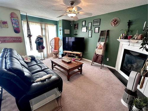 33 Sierra Drive, Olds, AB - Indoor Photo Showing Living Room With Fireplace