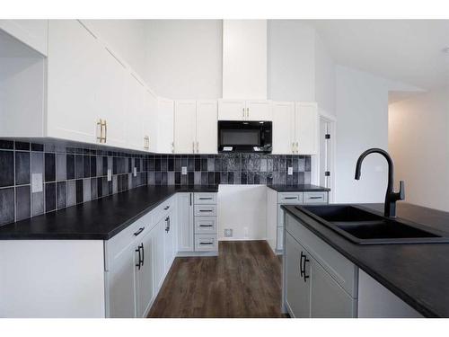 125 Upland Boulevard, Brooks, AB - Indoor Photo Showing Kitchen With Double Sink