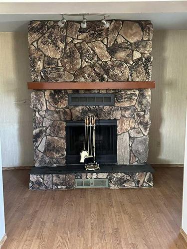 219 4 Avenue South, Youngstown, AB - Indoor With Fireplace