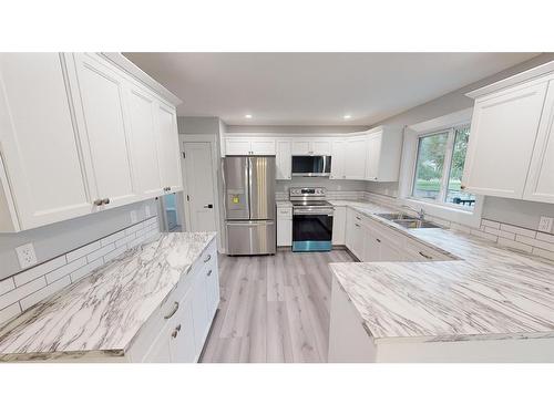 39 Wildrose Crescent, Brooks, AB - Indoor Photo Showing Kitchen With Double Sink