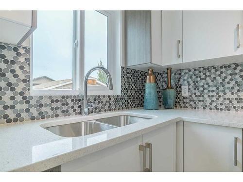 243 16 Street East, Brooks, AB - Indoor Photo Showing Kitchen With Double Sink