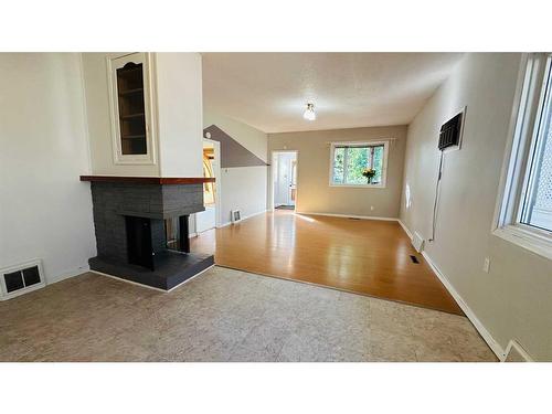 426 4 Street E, Drumheller, AB - Indoor With Fireplace