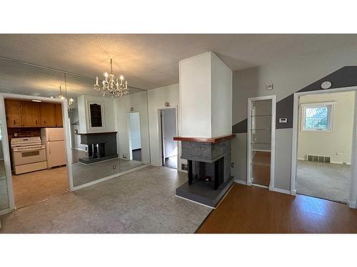 426 4 Street E, Drumheller, AB - Indoor With Fireplace