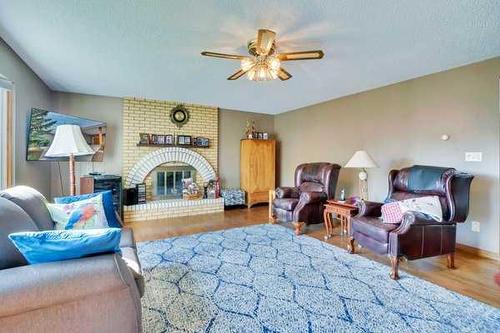 609 Kennedy Place, Hanna, AB - Indoor Photo Showing Living Room With Fireplace