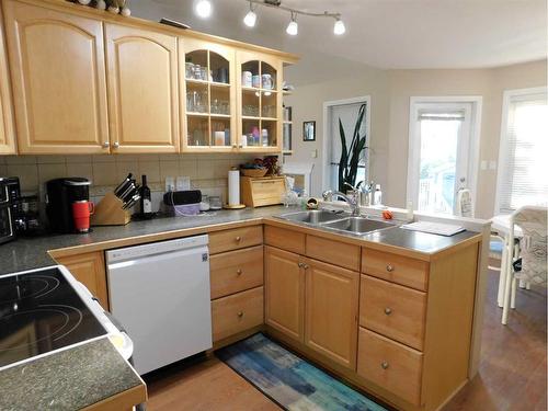 87 Greystone Close East, Brooks, AB - Indoor Photo Showing Kitchen With Double Sink