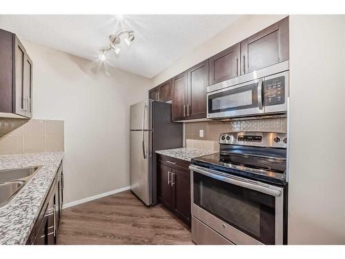 2418-81 Legacy Boulevard, Calgary, AB - Indoor Photo Showing Kitchen With Stainless Steel Kitchen With Double Sink