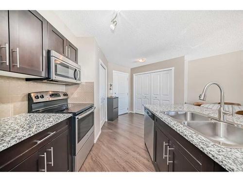 2418-81 Legacy Boulevard Se, Calgary, AB - Indoor Photo Showing Kitchen With Stainless Steel Kitchen With Double Sink With Upgraded Kitchen