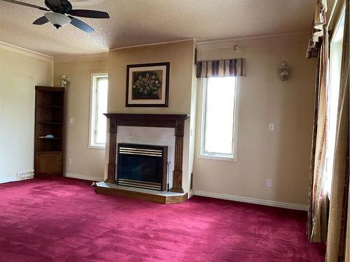 413 9 Street East, Drumheller, AB - Indoor Photo Showing Living Room With Fireplace