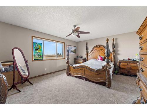 464 Sunset Link, Crossfield, AB - Indoor Photo Showing Bedroom