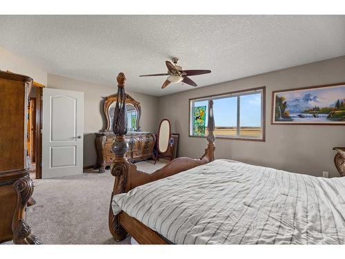 464 Sunset Link, Crossfield, AB - Indoor Photo Showing Bedroom