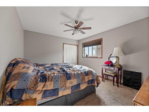 464 Sunset Link, Crossfield, AB - Indoor Photo Showing Bedroom